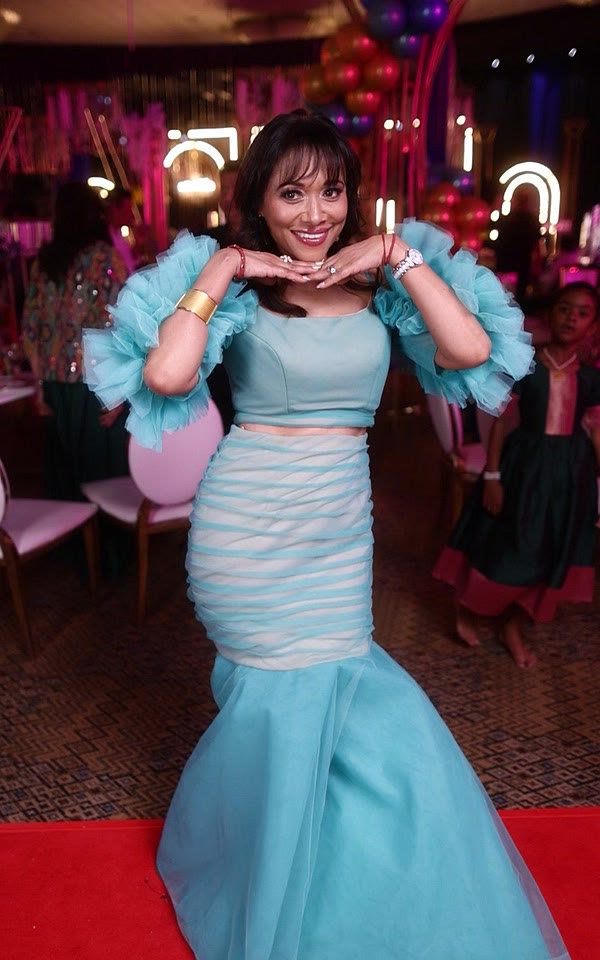 Guest in a mint tulle gown on the GlamBot® red carpet
